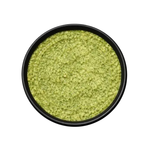 A professional 90-degree top-down flat lay of Pot and Ladle brand Bengaluru Donne Biryani Paste. The concentrated masala is a thick, textured, deep olive-green paste made from fresh mint, coriander, and green chilies. The surface shows a glossy sheen and visible bits of coarsely ground spices, served in a small black bowl on a seamless white studio background.