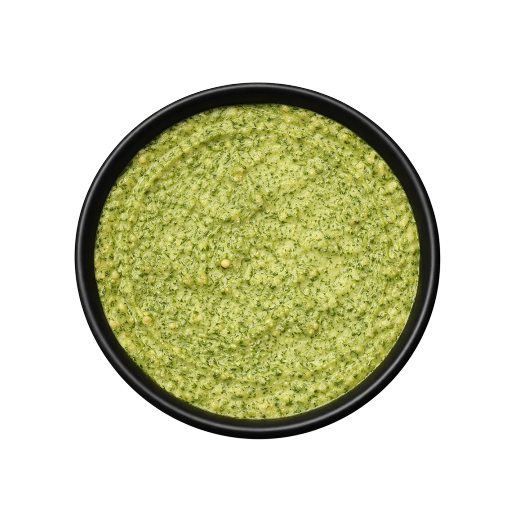 A professional 90-degree top-down flat lay of Pot and Ladle brand Bengaluru Donne Biryani Paste. The concentrated masala is a thick, textured, deep olive-green paste made from fresh mint, coriander, and green chilies. The surface shows a glossy sheen and visible bits of coarsely ground spices, served in a small black bowl on a seamless white studio background.
