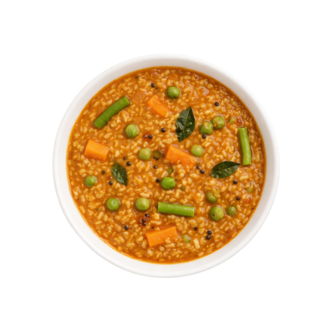 Karnataka style Bisi Bele Bath ready to eat lentil rice dish in white bowl