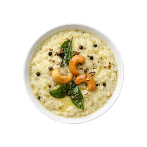 Ghee Pongal ready to eat with black pepper and cashews served in white bowl