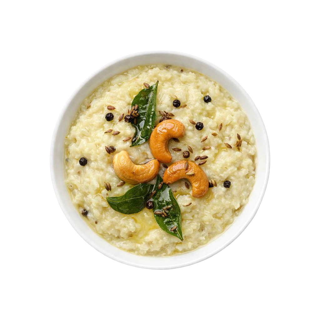 Ghee Pongal ready to eat with black pepper and cashews served in white bowl