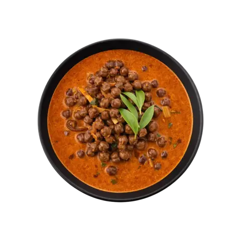 Kerala Kadala Curry ready to eat black chickpea curry in black bowl