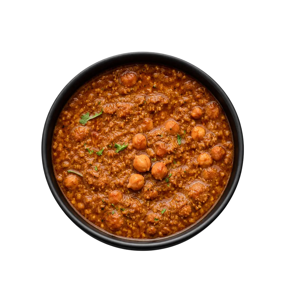 Pot and Ladle Punjabi Chole Masala ready-to-eat product served in a black china bowl with rich chickpea curry
