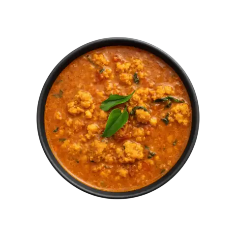 South Indian Vada Curry ready to eat lentil gravy served in black bowl